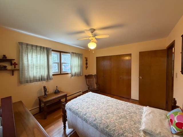 5563 Stone Drive Clinton, IL 61727 - Photo 22 of 34 a bedroom with a bed and a chandelier