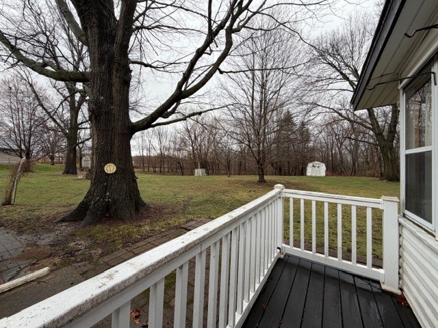 5563 Stone Drive Clinton, IL 61727 - Photo 27 of 34 a view of a wooden deck and a yard