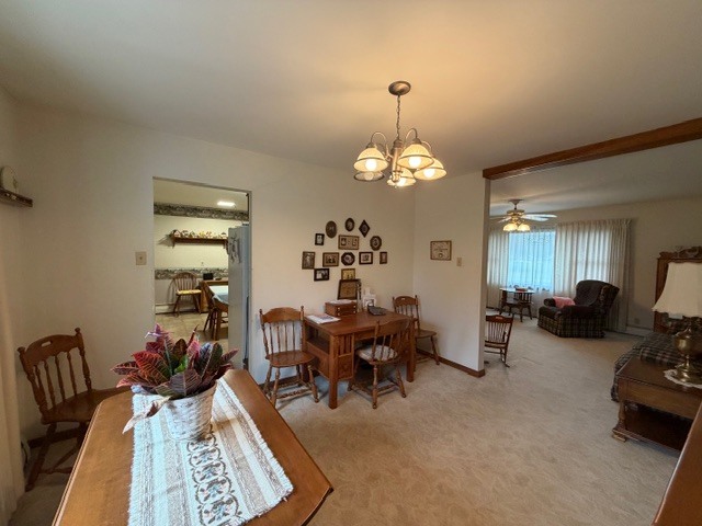 5563 Stone Drive Clinton, IL 61727 - Photo 9 of 34 a living room with furniture chandelier and a chandelier