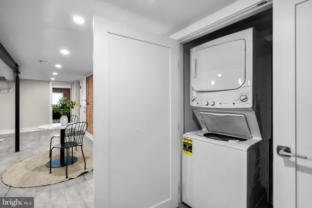 a bed room with a bed and a chair