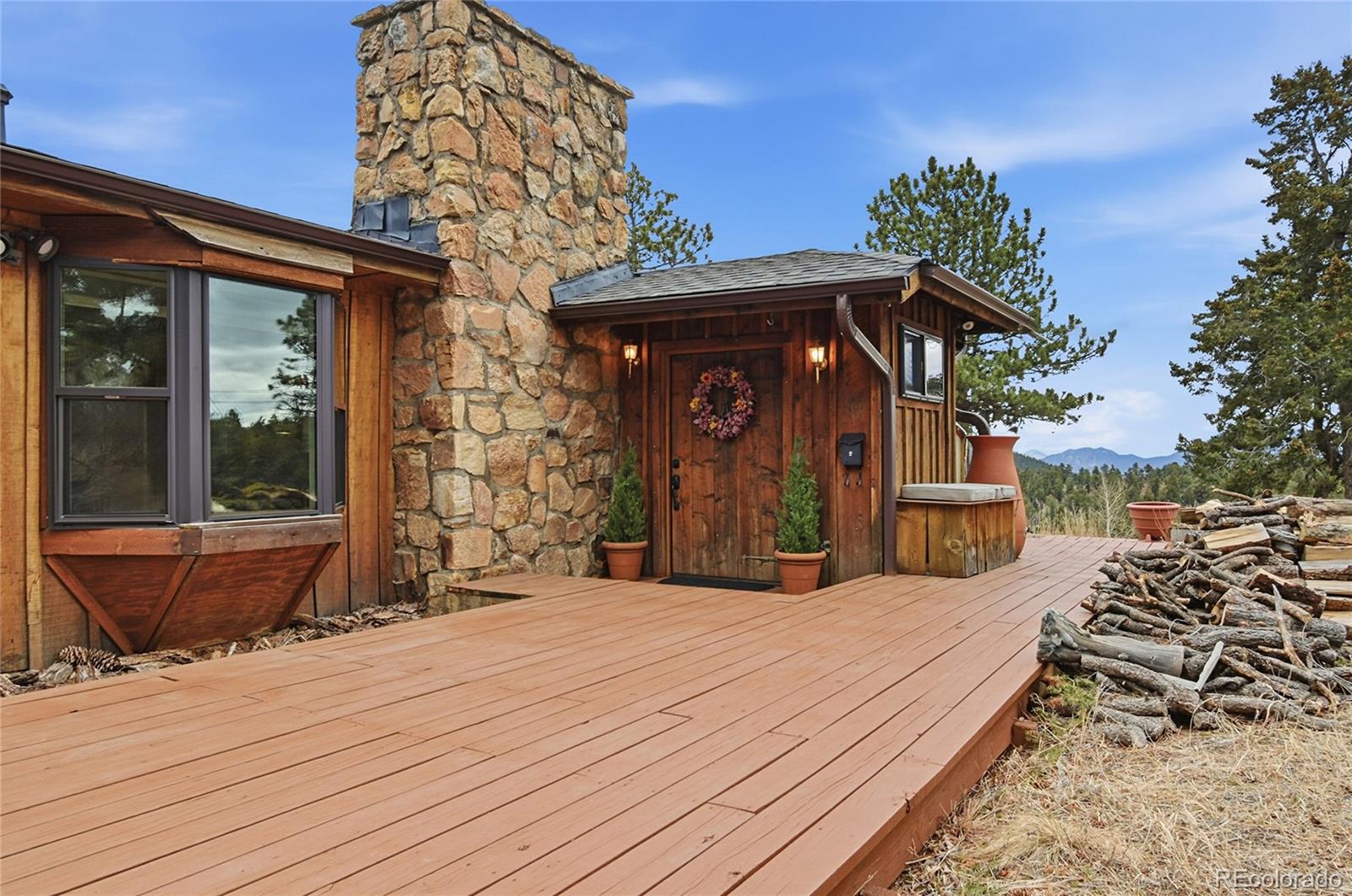 a view of a house with wooden deck