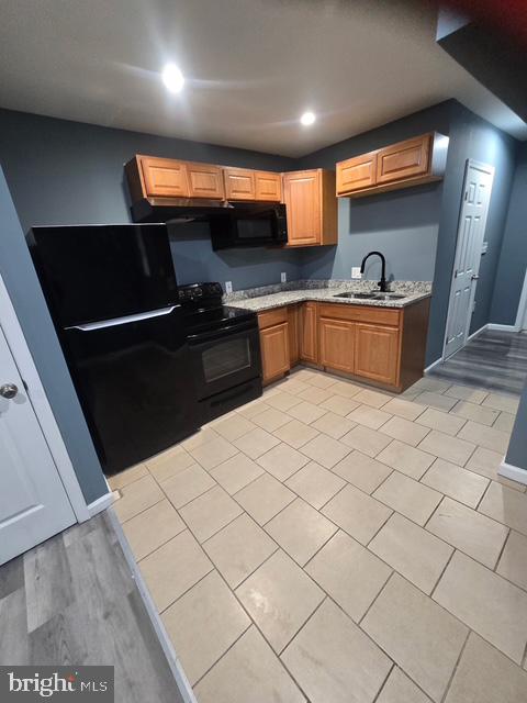 a kitchen with stainless steel appliances a sink and a stove