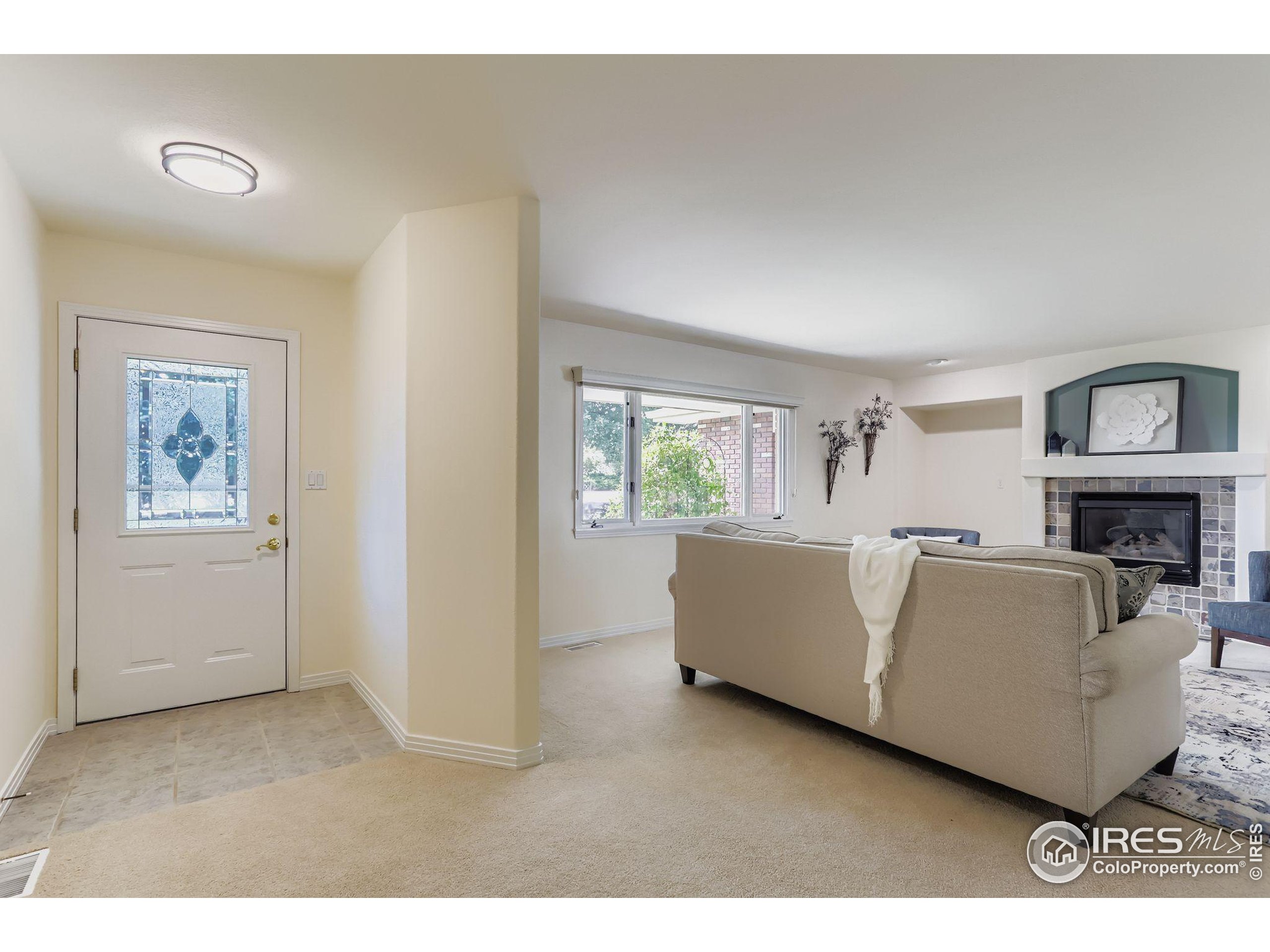 3600 Quail Road Longmont, CO 80503 - Photo 20 of 39 a living room with furniture and a window