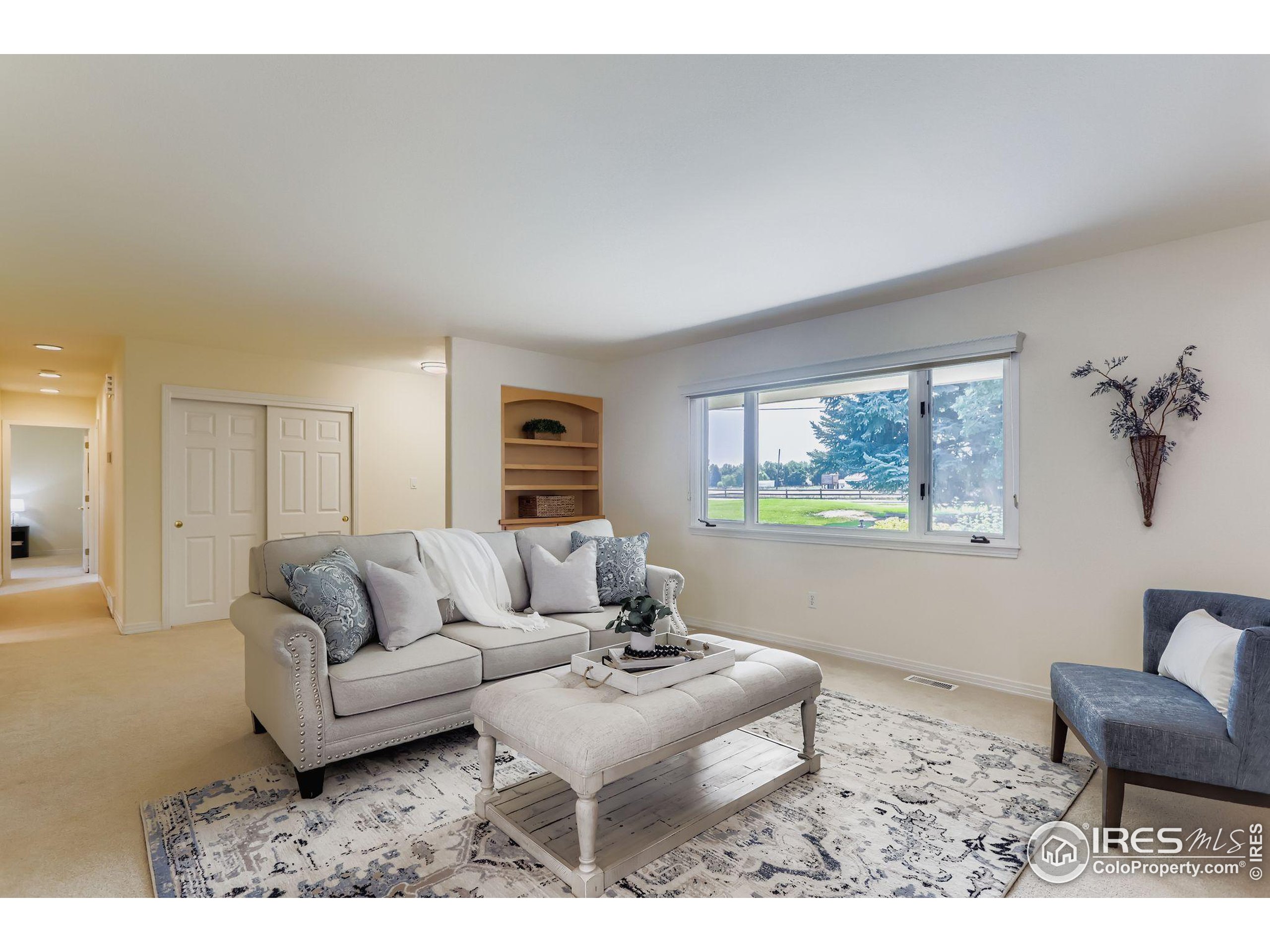 3600 Quail Road Longmont, CO 80503 - Photo 24 of 39 a living room with furniture and a window