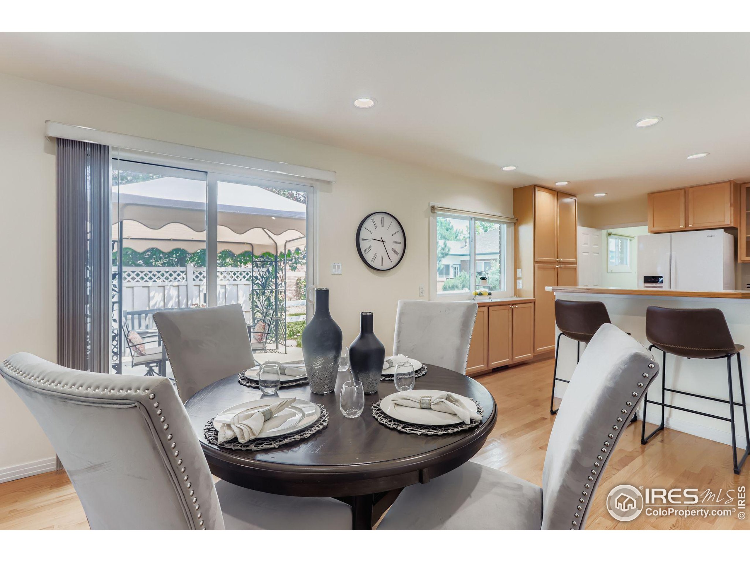 3600 Quail Road Longmont, CO 80503 - Photo 25 of 39 a view of a dining room with furniture window and wooden floor