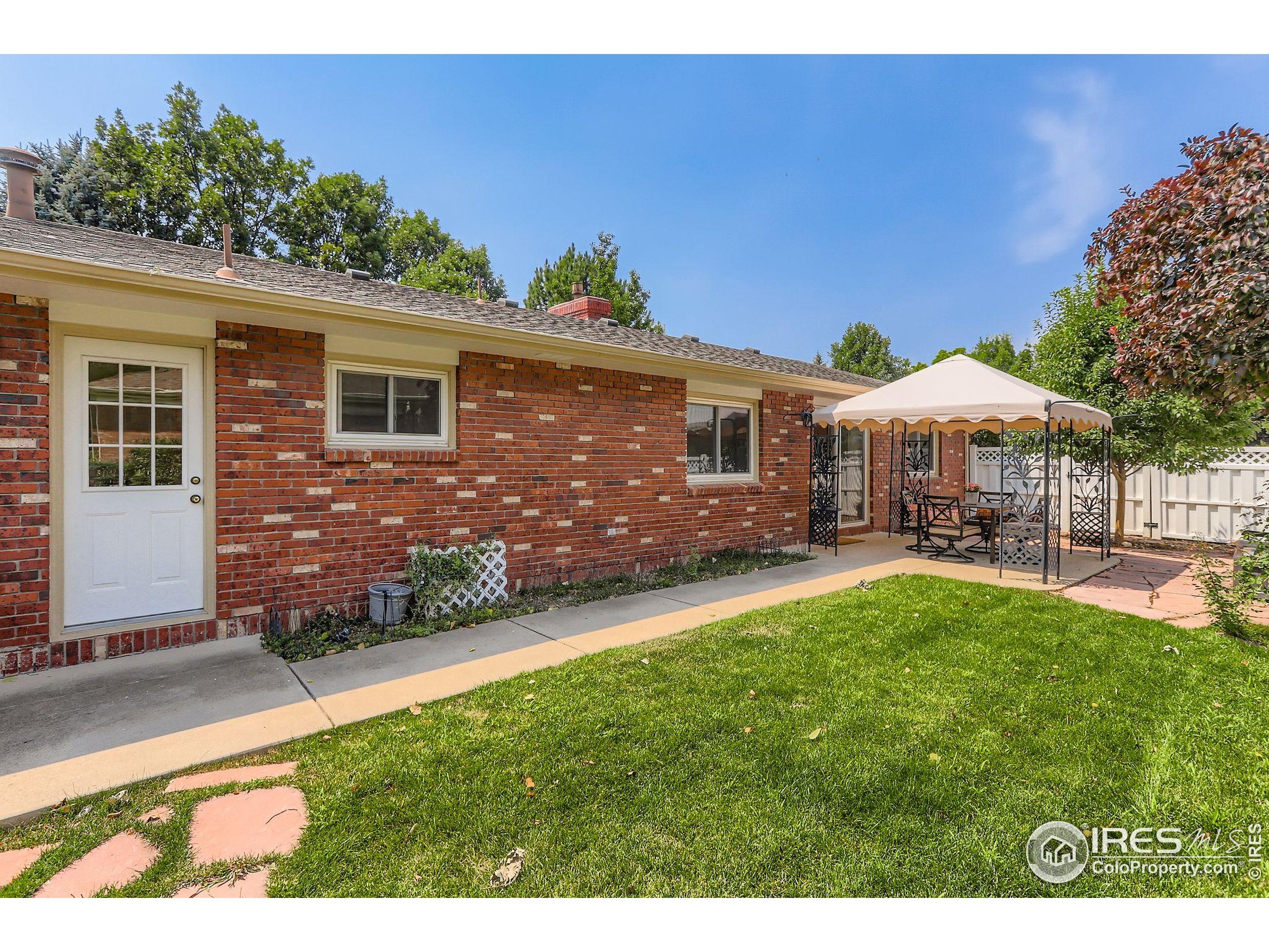 3600 Quail Road Longmont, CO 80503 - Photo 3 of 39 a front view of a house with yard and green space