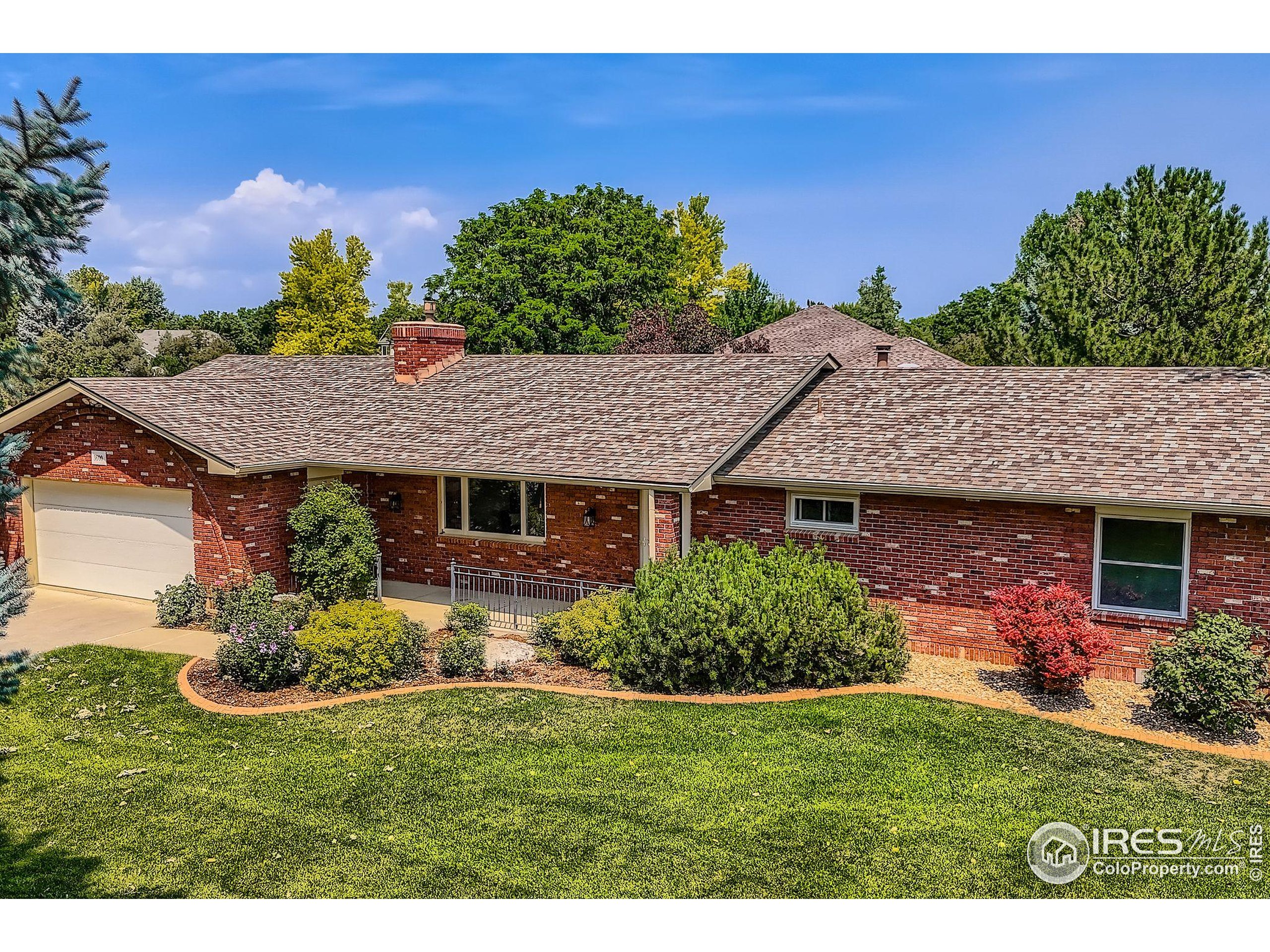3600 Quail Road Longmont, CO 80503 - Photo 6 of 39 a view of a house with a garden