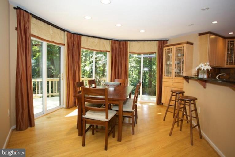 11601 Brandon Hill Way Reston, VA 20194 - Photo 2 of 27 a view of a dining room with furniture water view and a large window