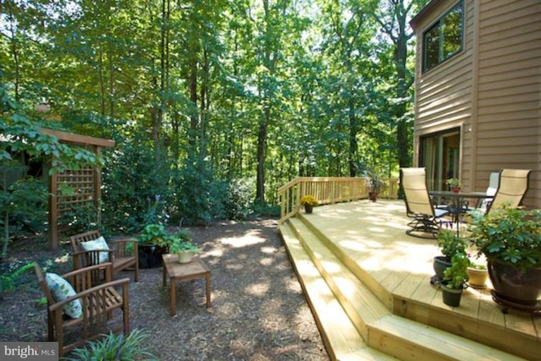 11601 Brandon Hill Way Reston, VA 20194 - Photo 11 of 27 a view of backyard with seating space and trees in the background