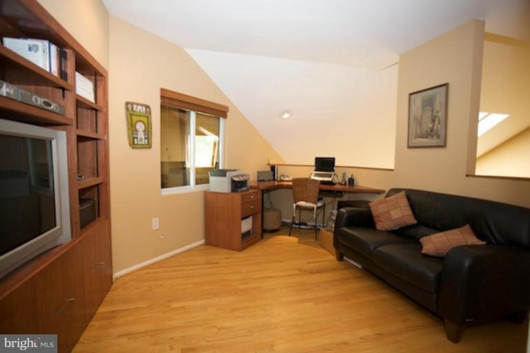 11601 Brandon Hill Way Reston, VA 20194 - Photo 13 of 27 a living room with furniture and a flat screen tv