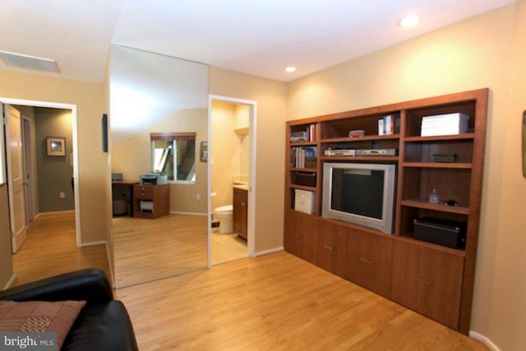 11601 Brandon Hill Way Reston, VA 20194 - Photo 15 of 27 a living room with stainless steel appliances kitchen island granite countertop a refrigerator and a stove top oven
