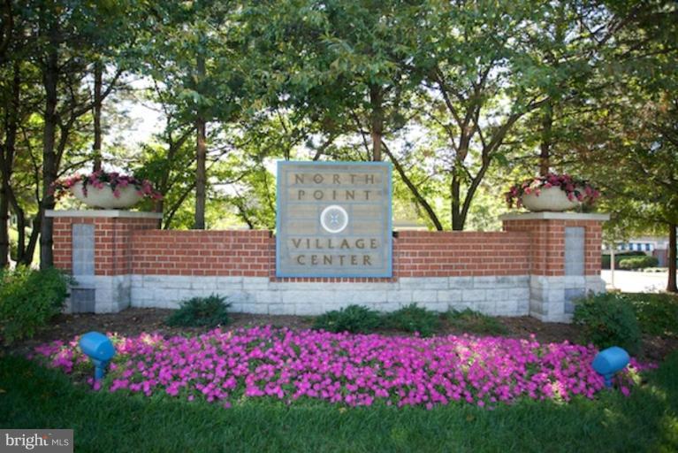 11601 Brandon Hill Way Reston, VA 20194 - Photo 27 of 27 a sign that is sitting in front of flowers