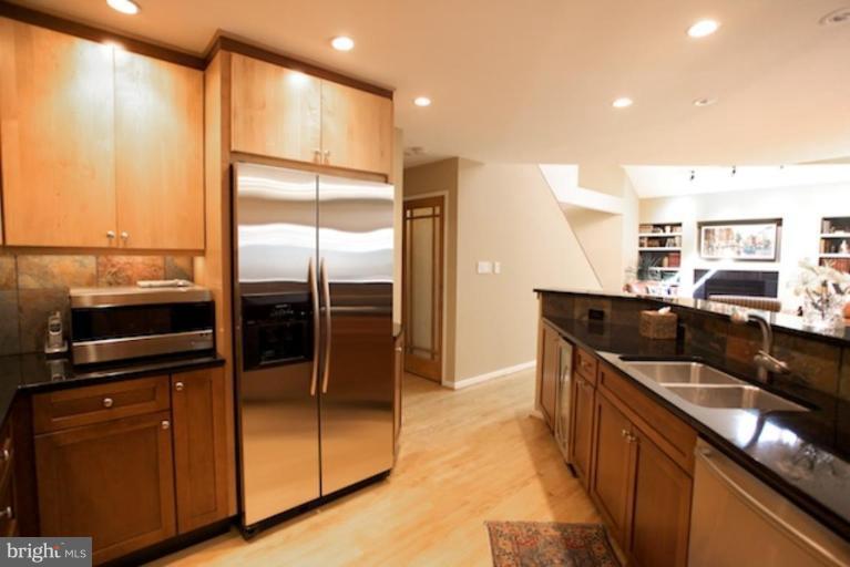 11601 Brandon Hill Way Reston, VA 20194 - Photo 5 of 27 a kitchen with stainless steel appliances granite countertop a refrigerator a stove and a sink