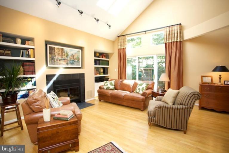 11601 Brandon Hill Way Reston, VA 20194 - Photo 8 of 27 a living room with furniture and a fireplace