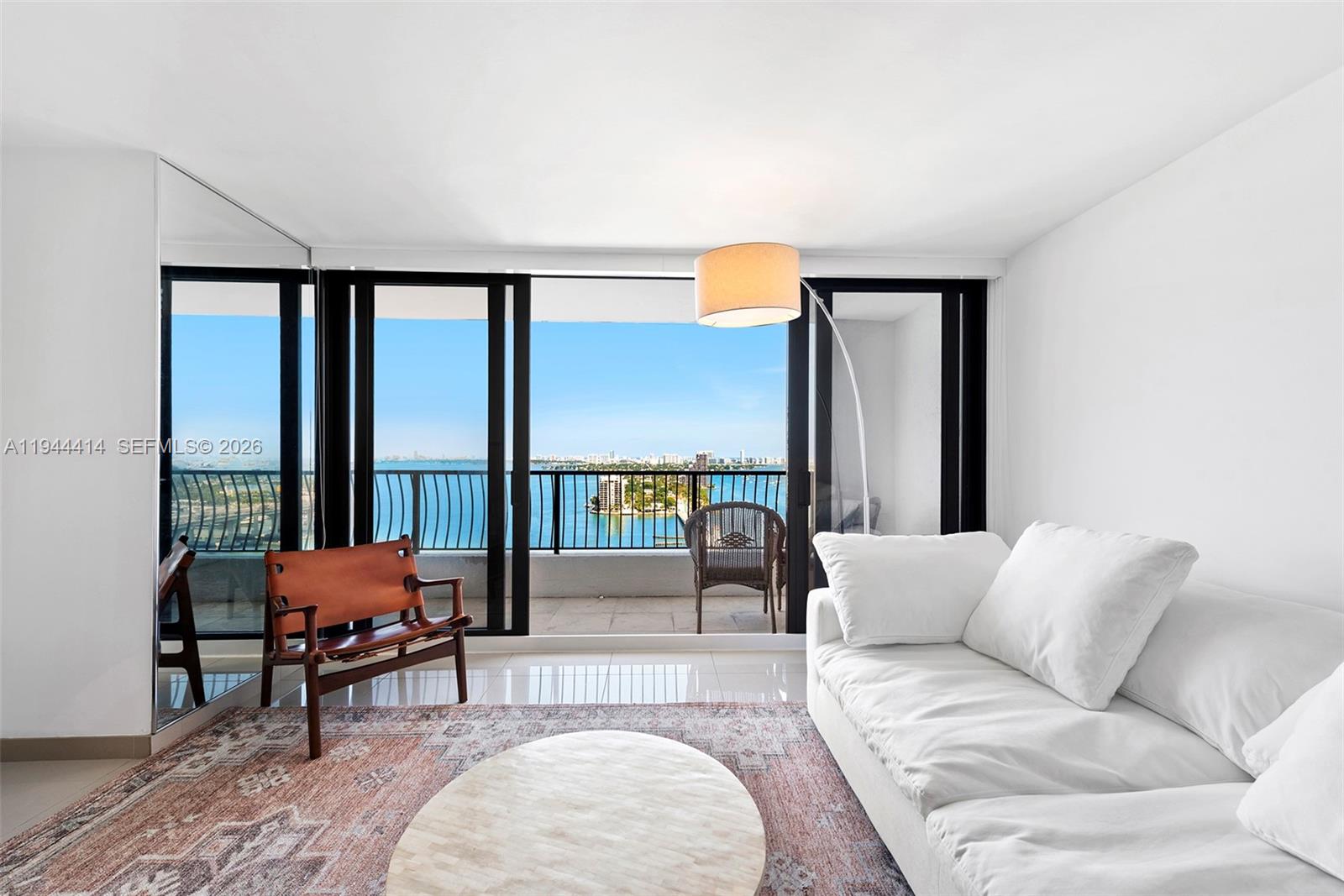 555 Northeast 15th Street, Unit 26B Miami, FL 33132 - Photo 4 of 18 a living room with furniture and a large window