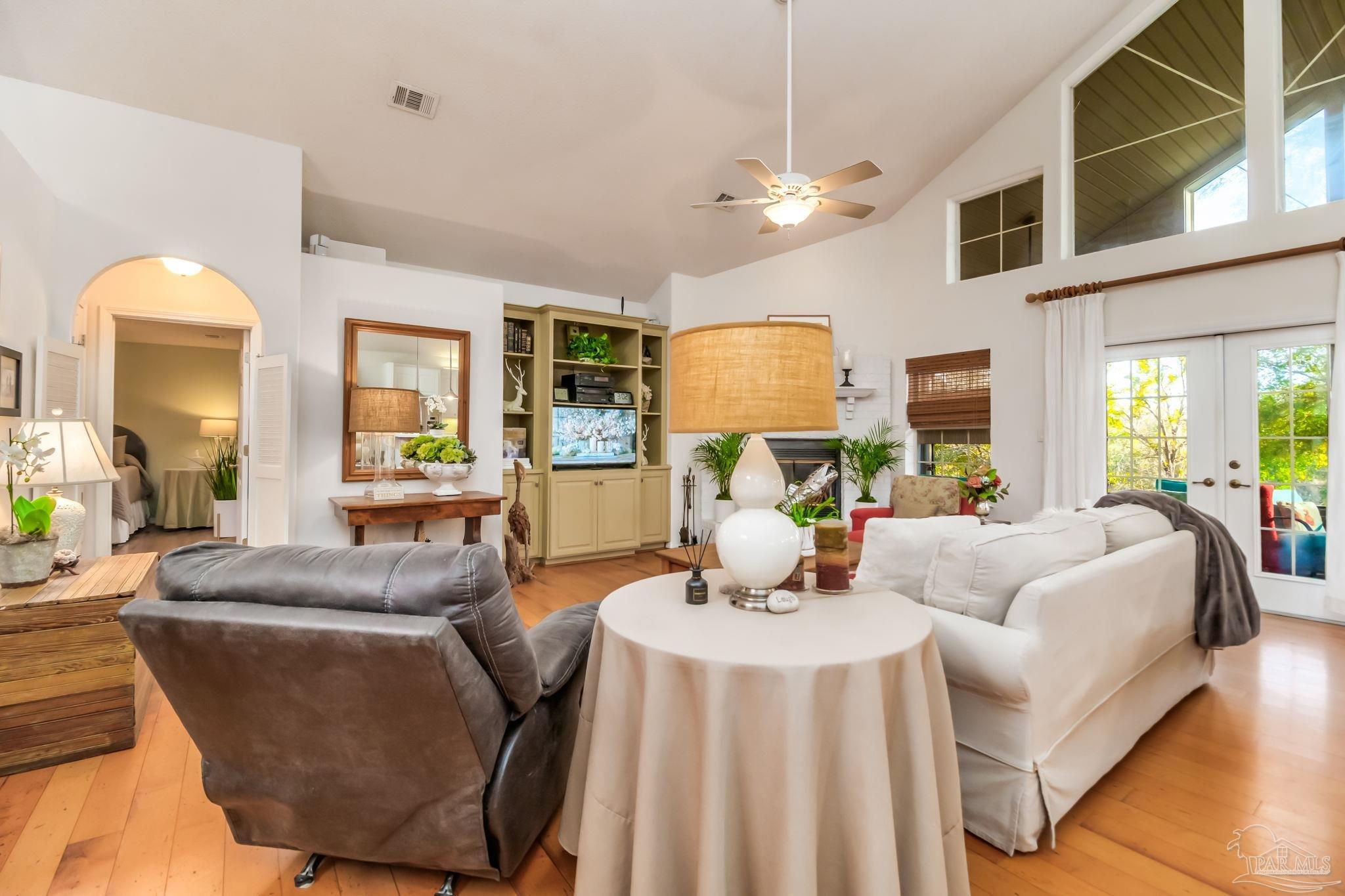 5150-5172 Siripon Road Milton, FL 32570 - Photo 14 of 54 a living room with furniture a lamp and a large window