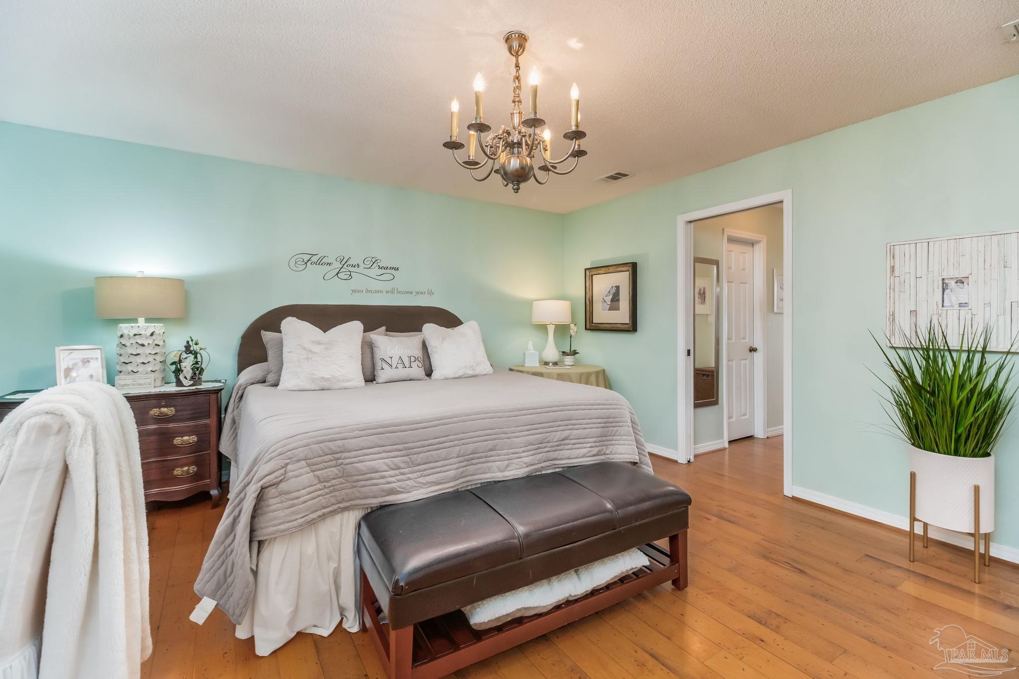 5150-5172 Siripon Road Milton, FL 32570 - Photo 16 of 54 a bedroom with bed and window