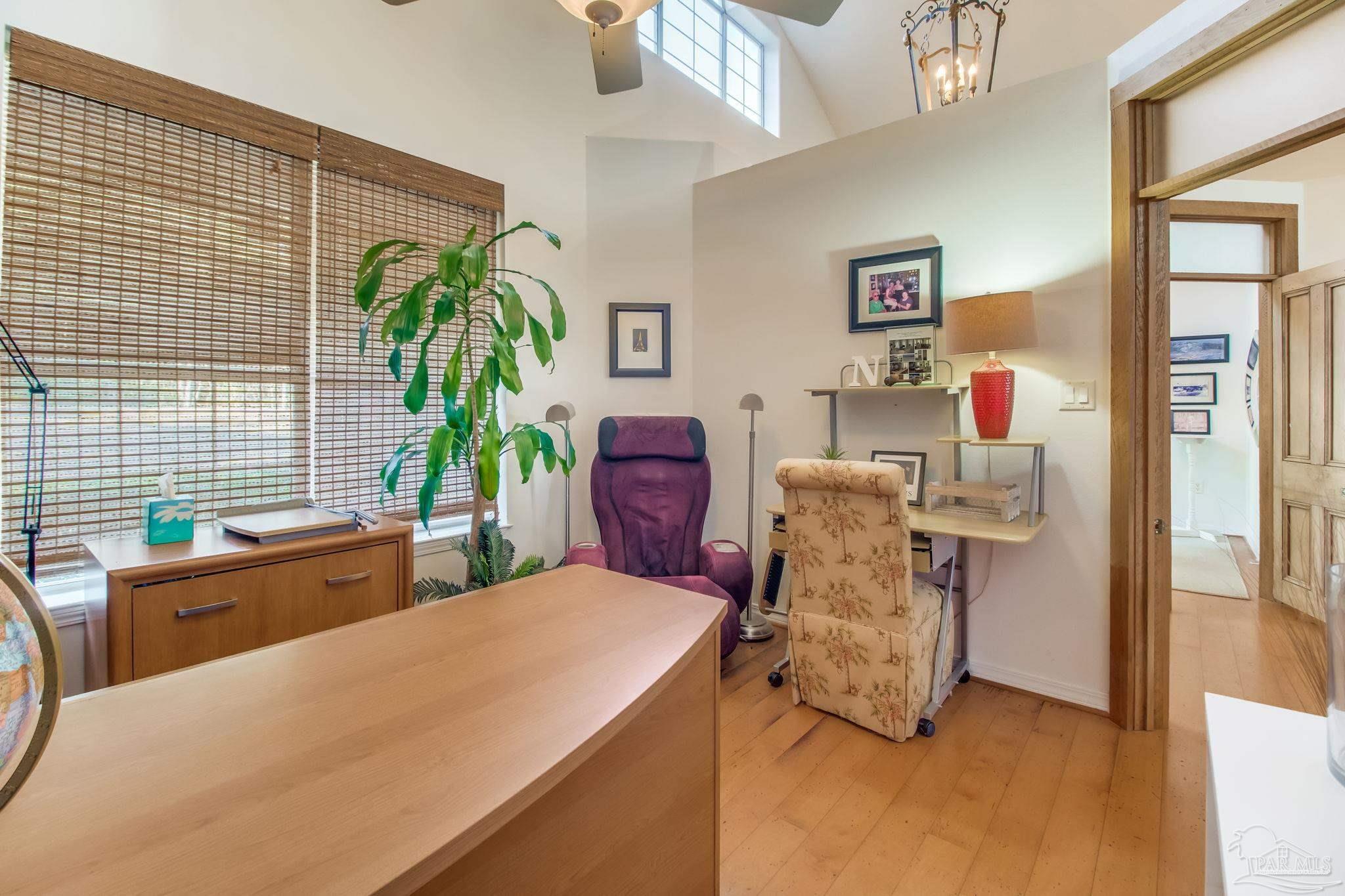 5150-5172 Siripon Road Milton, FL 32570 - Photo 19 of 54 a living room with furniture and a potted plant