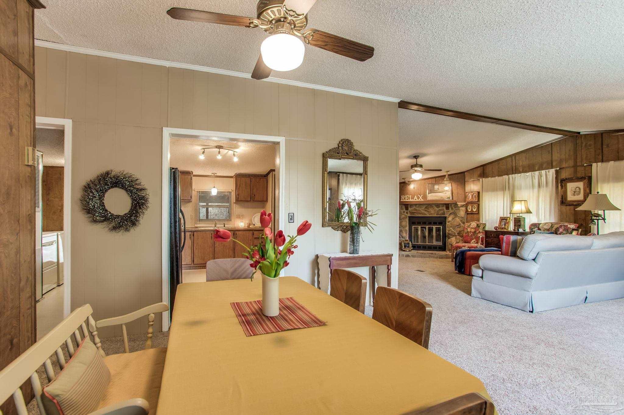 5150-5172 Siripon Road Milton, FL 32570 - Photo 33 of 54 a lobby with furniture and chandelier