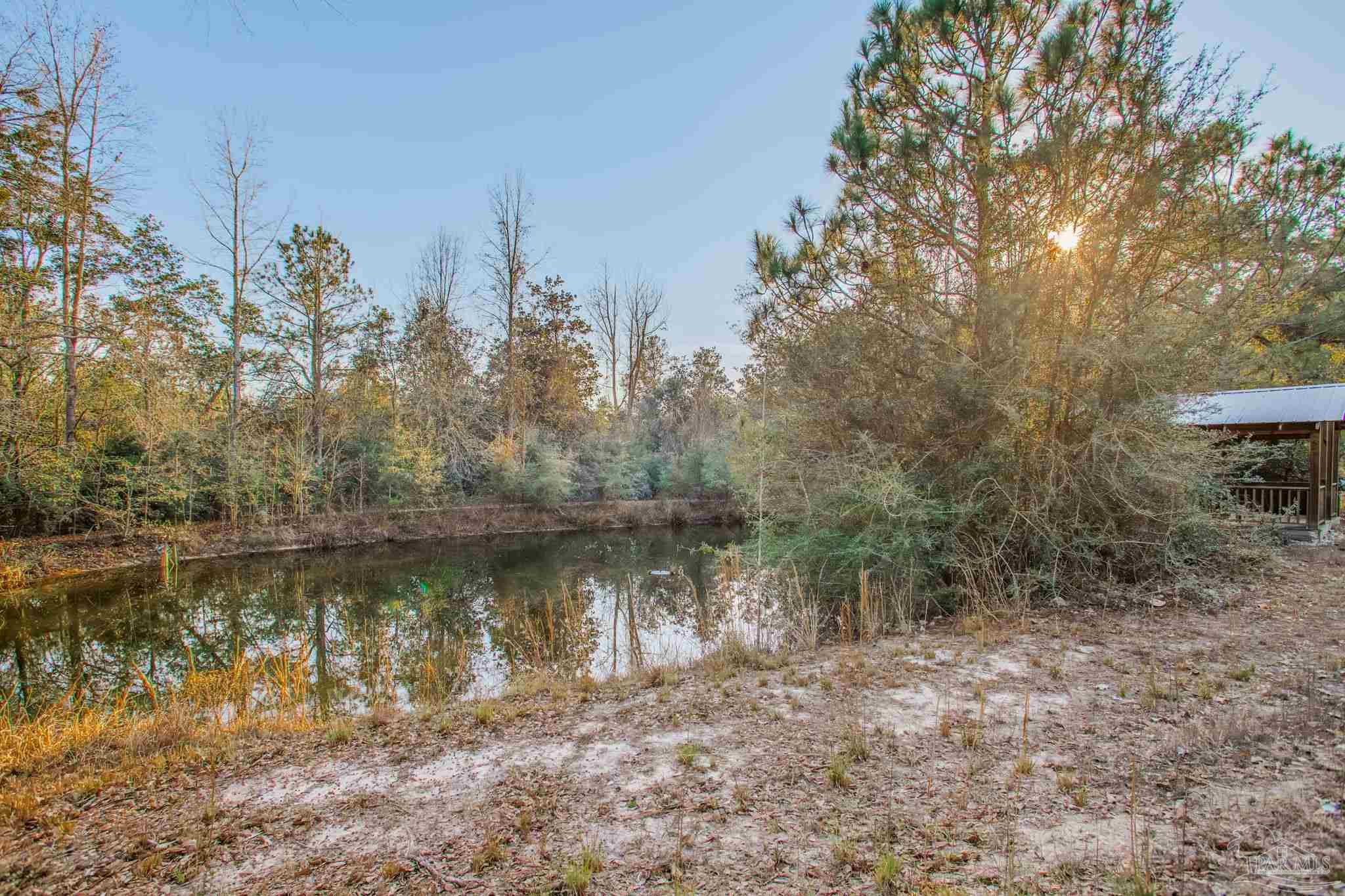 5150-5172 Siripon Road Milton, FL 32570 - Photo 44 of 54 a view of a large body of water surrounded by trees