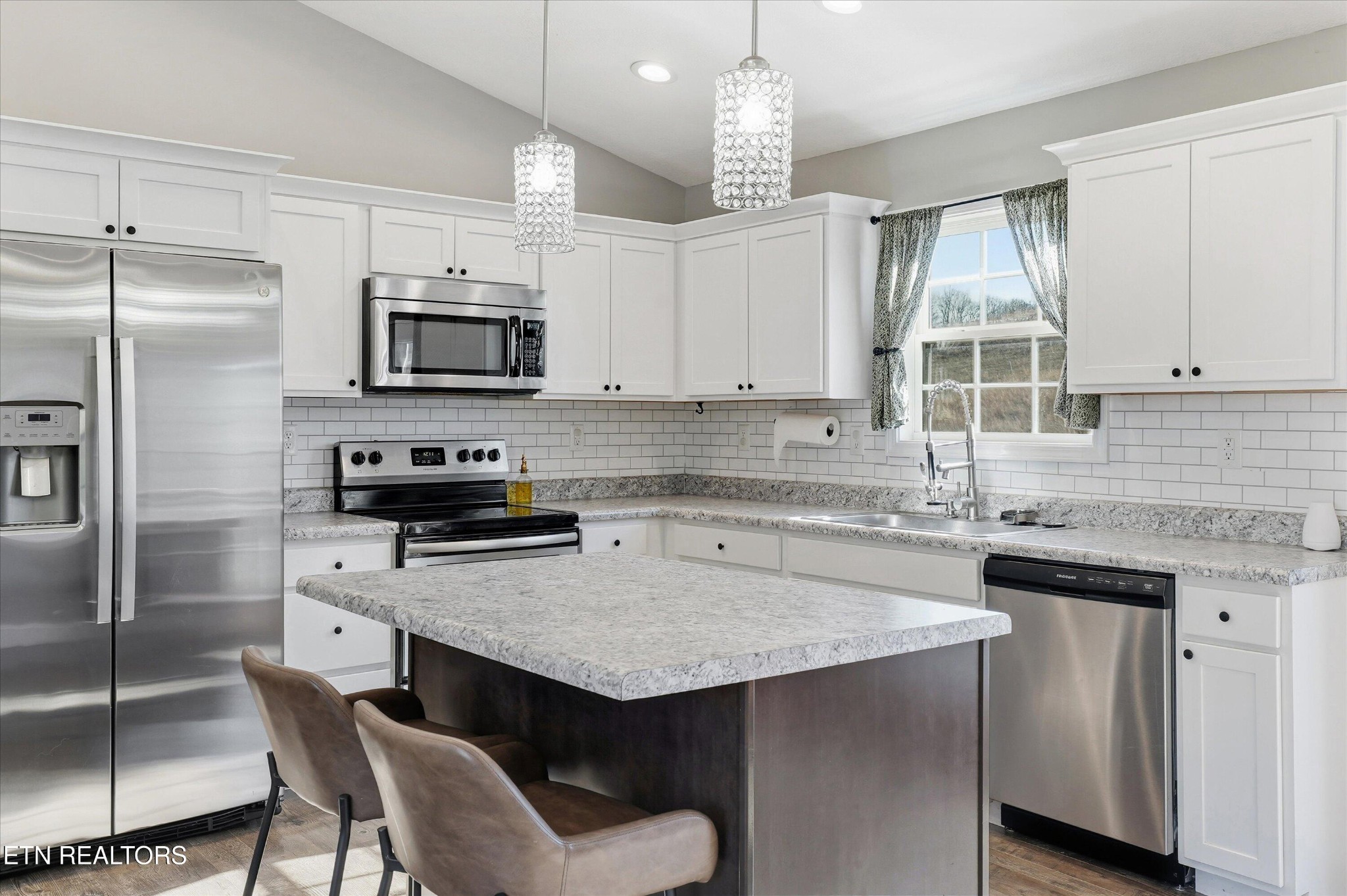 400 Hubbs Grove Road Maynardville, TN 37807 - Photo 15 of 46 a kitchen with kitchen island granite countertop a sink counter space appliances and cabinets