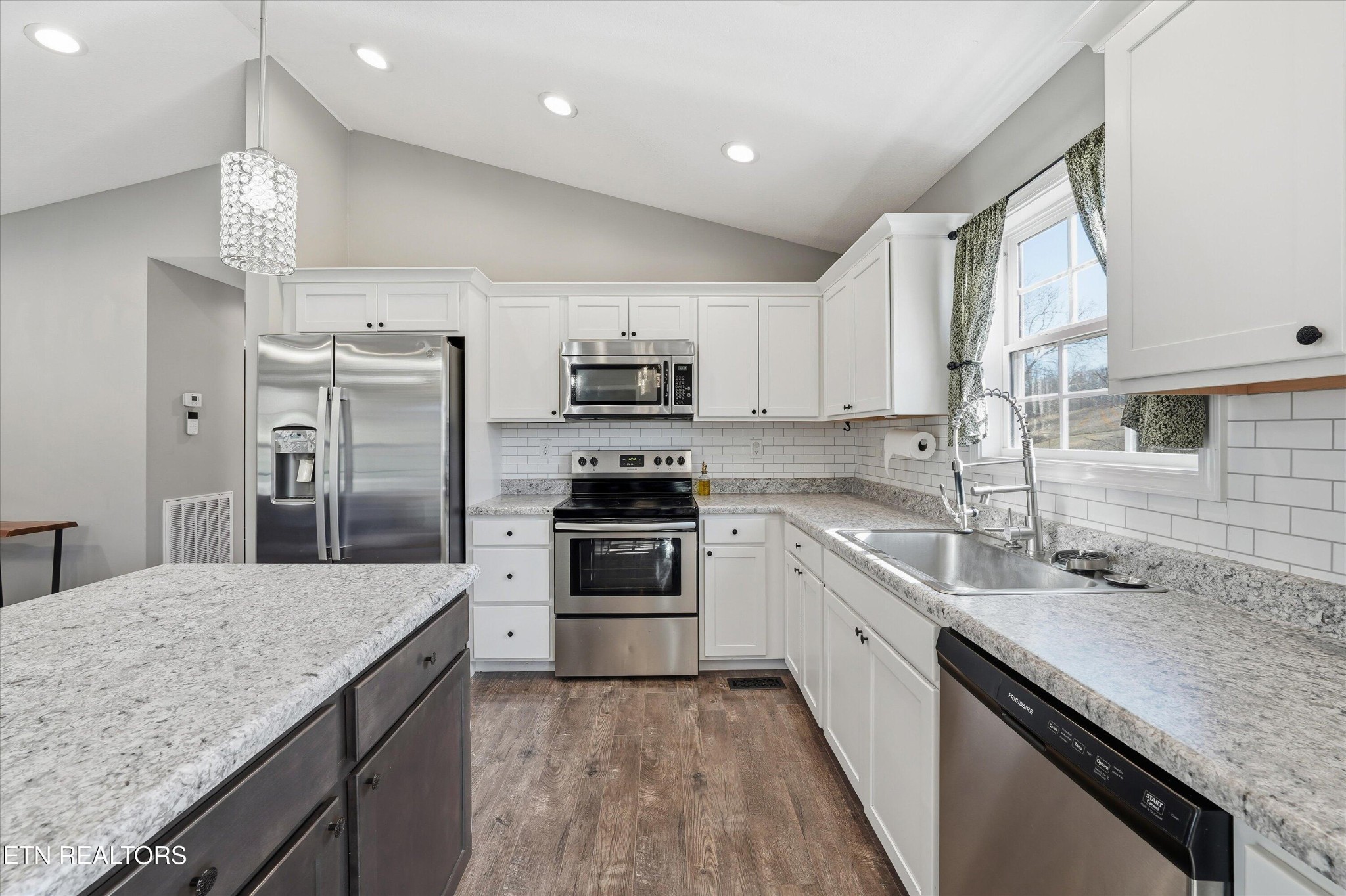 400 Hubbs Grove Road Maynardville, TN 37807 - Photo 18 of 46 a kitchen with a sink stainless steel appliances and white cabinets