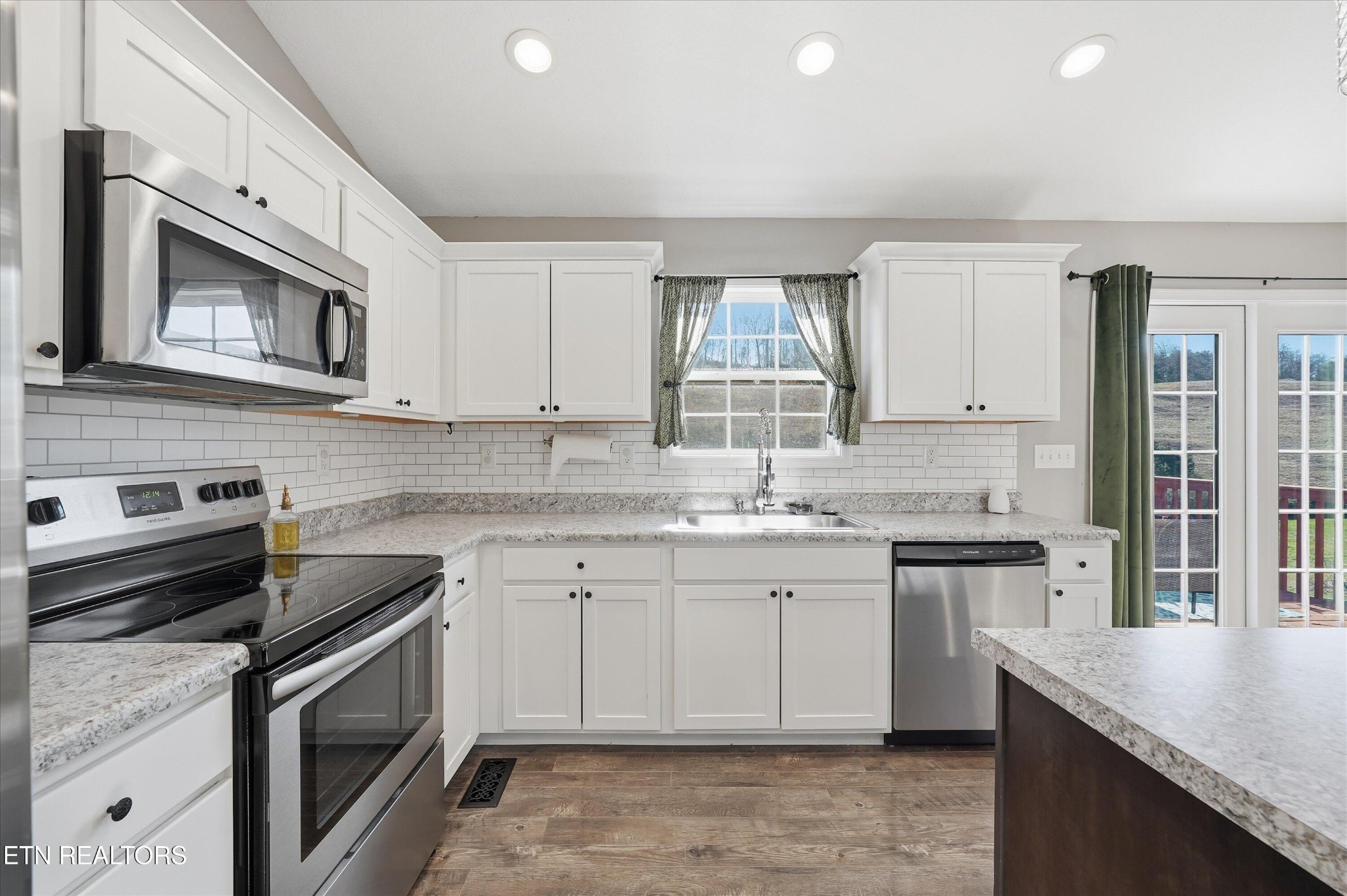400 Hubbs Grove Road Maynardville, TN 37807 - Photo 21 of 46 a kitchen with stainless steel appliances granite countertop a sink and stove top oven