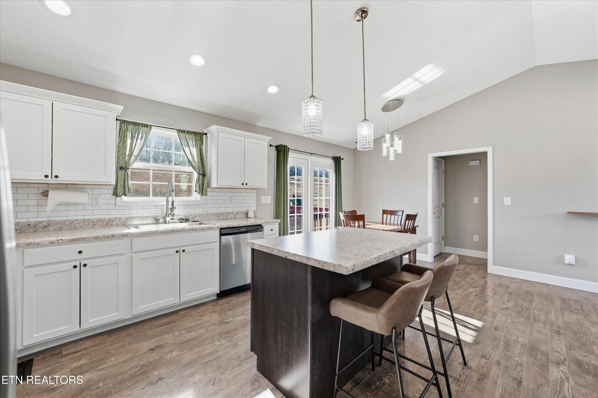 400 Hubbs Grove Road Maynardville, TN 37807 - Photo 22 of 46 a kitchen with center island table and chairs