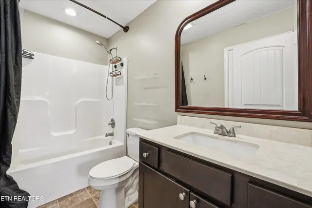 a bathroom with a sink a toilet and a bathtub