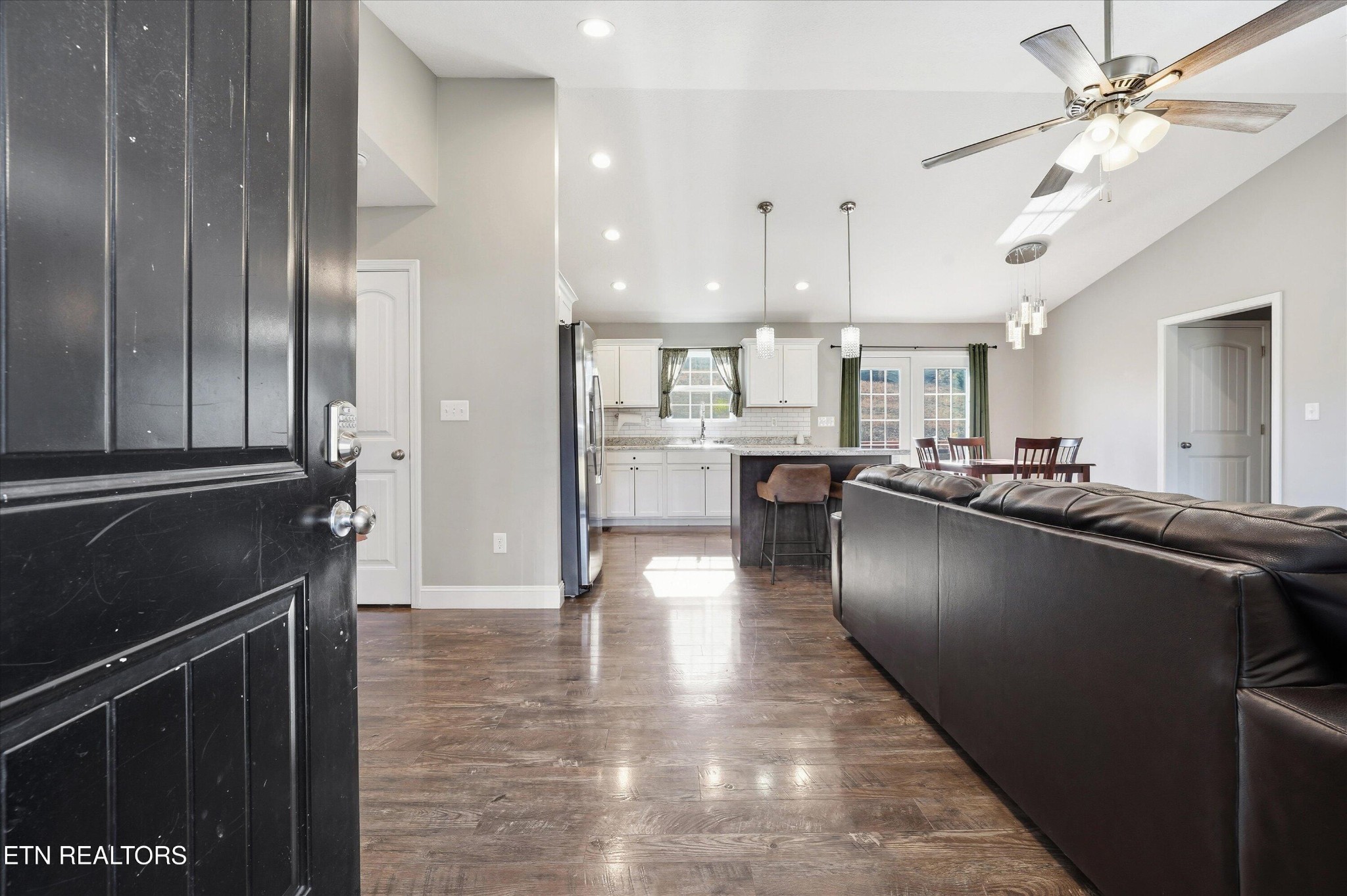 400 Hubbs Grove Road Maynardville, TN 37807 - Photo 6 of 46 a kitchen with stainless steel appliances granite countertop a refrigerator a sink a stove and oven with wooden floor