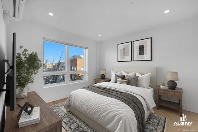 a bedroom with a bed and a couch