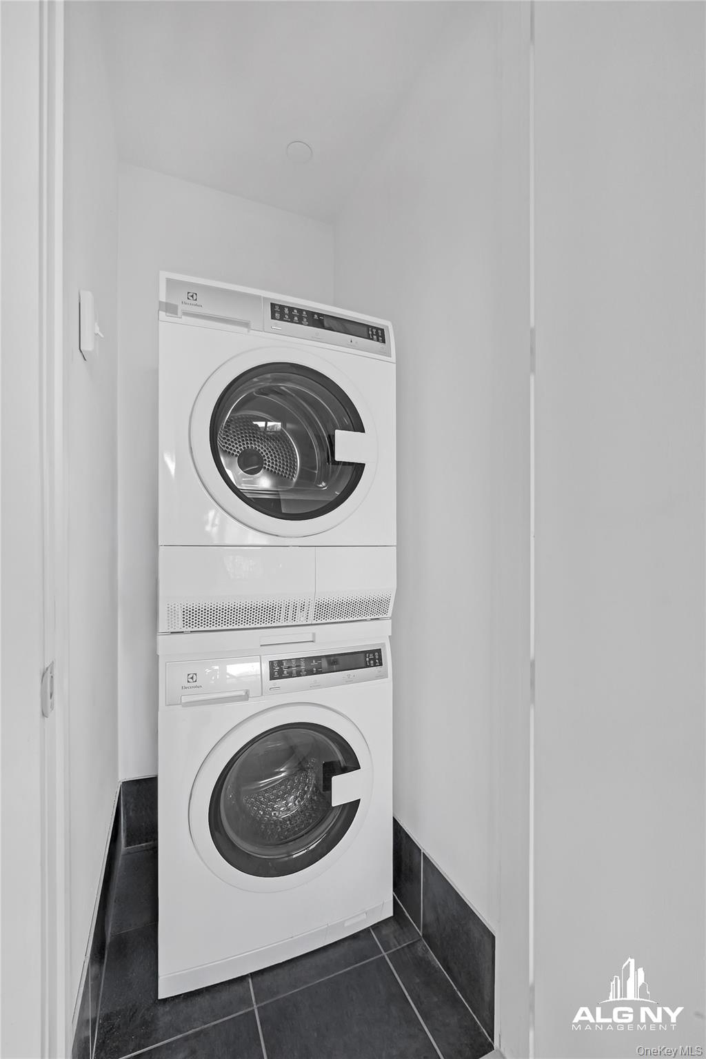 63-34 Fresh Pond Road, Unit 3G Queens, NY 11385 - Photo 5 of 6 a utility room with dryer and washer