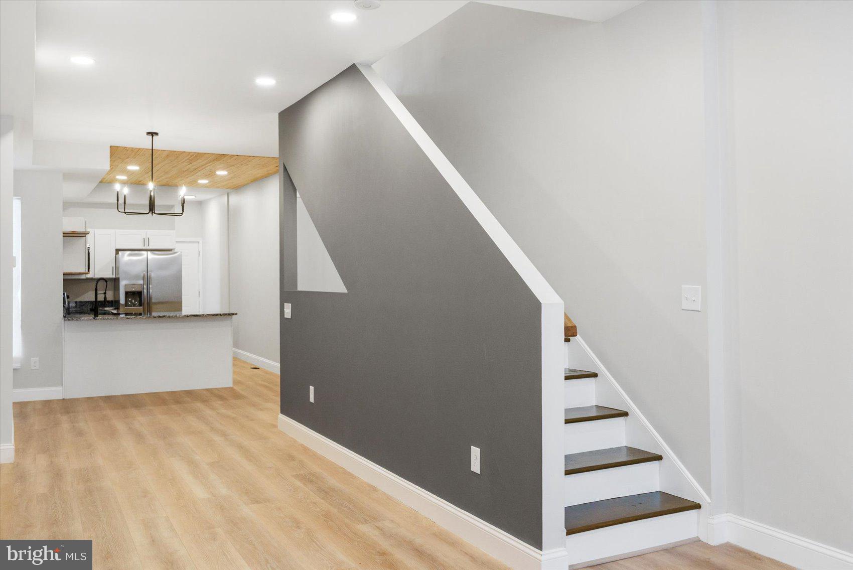 1415 East Lanvale Street Baltimore, MD 21213 - Photo 17 of 42 a view of a hallway with stairs and furniture