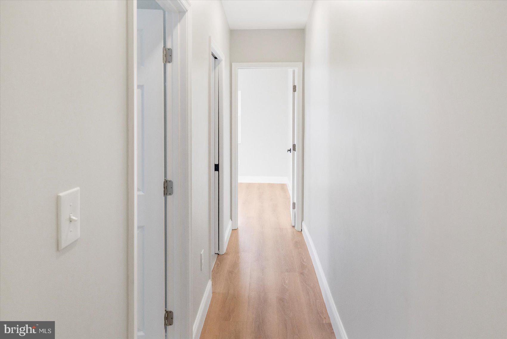 1415 East Lanvale Street Baltimore, MD 21213 - Photo 20 of 42 a view of a hallway with wooden floor