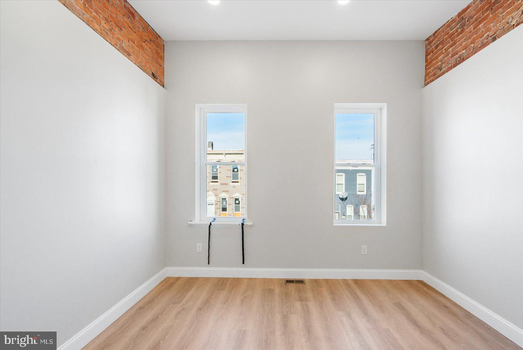 1415 East Lanvale Street Baltimore, MD 21213 - Photo 23 of 42 an empty room with windows