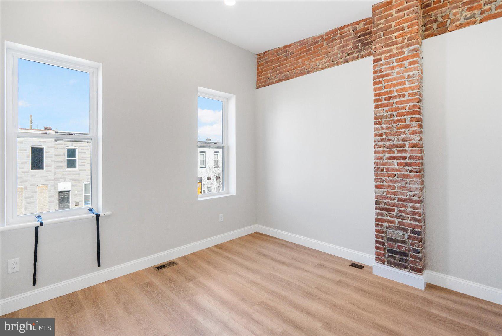 1415 East Lanvale Street Baltimore, MD 21213 - Photo 24 of 42 a view of a livingroom with wooden floor and windows