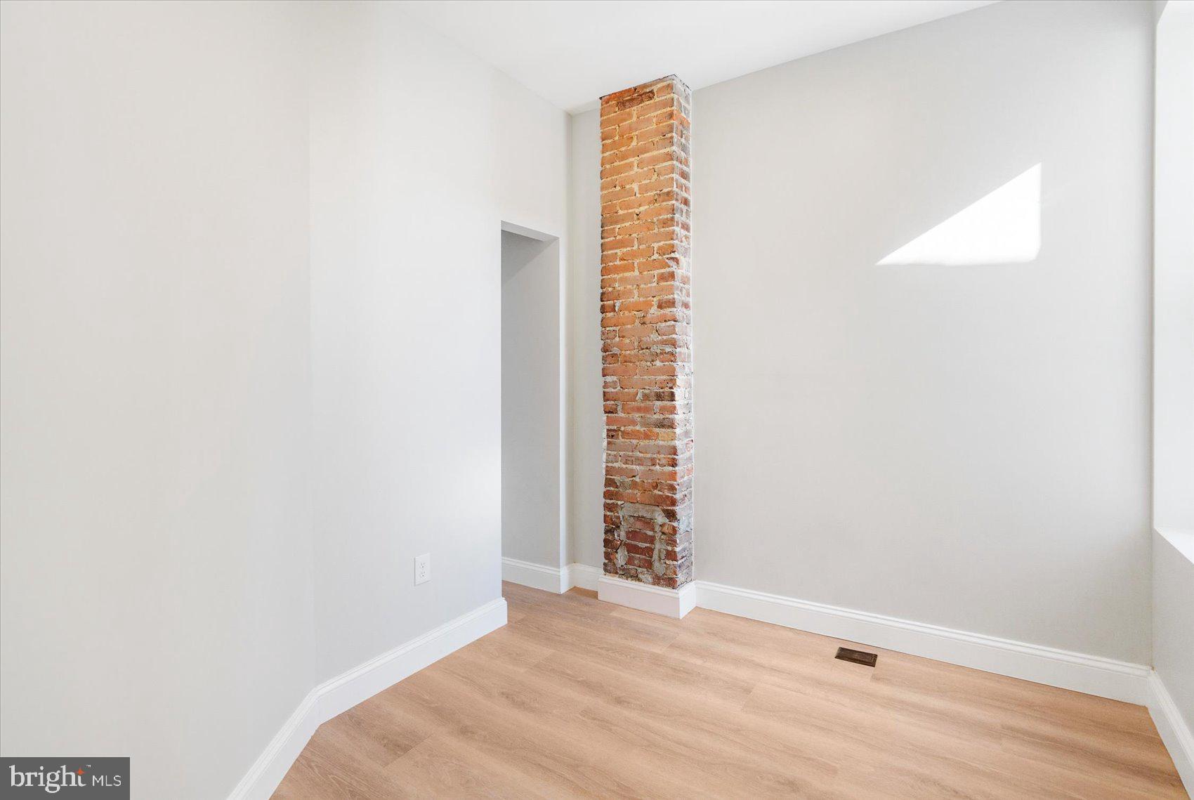 1415 East Lanvale Street Baltimore, MD 21213 - Photo 28 of 42 a view of wooden floor and windows in a room