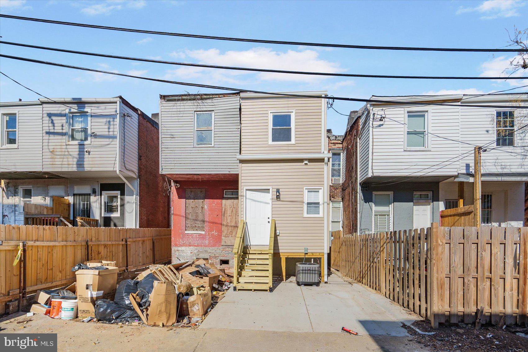 1415 East Lanvale Street Baltimore, MD 21213 - Photo 40 of 42 a view of a house with a patio