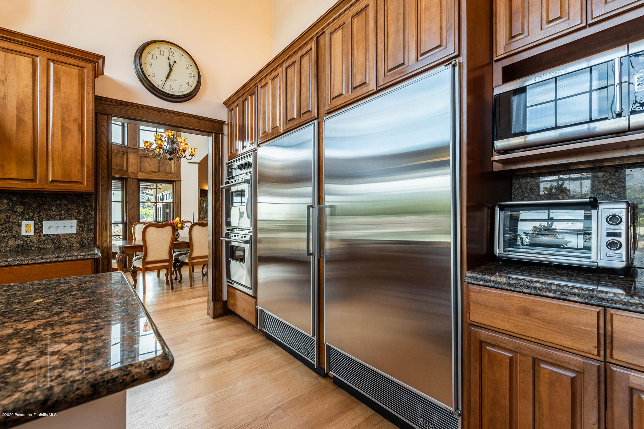 150 Sequoia Drive Pasadena, CA 91105 - Photo 16 of 53 a kitchen with granite countertop stainless steel appliances and wooden cabinets