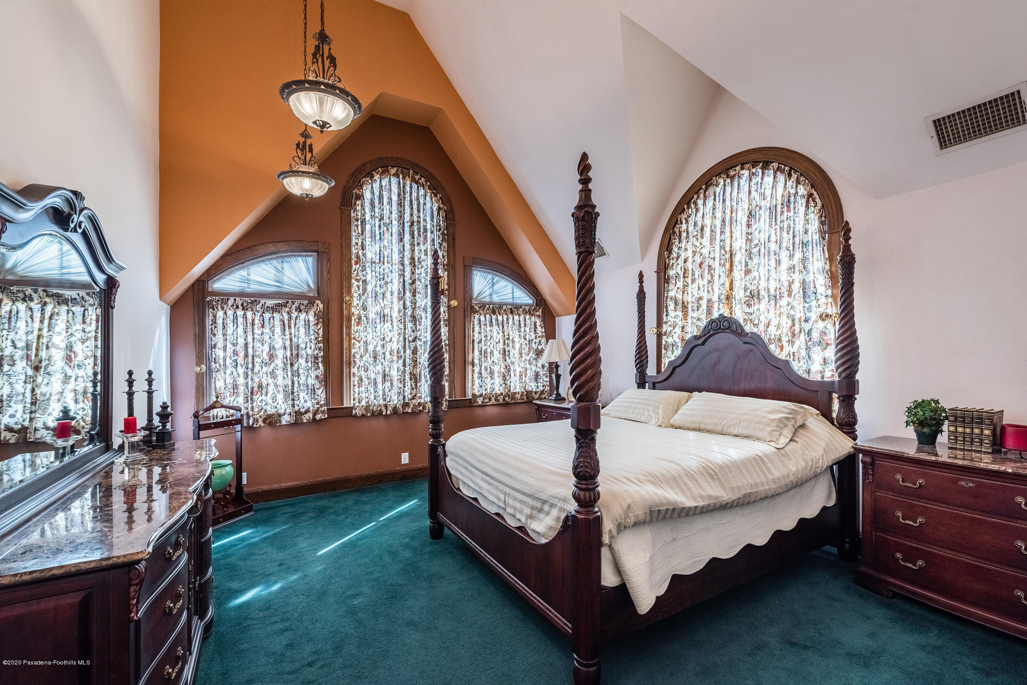 150 Sequoia Drive Pasadena, CA 91105 - Photo 18 of 53 a spacious bedroom with a bed a chandelier and dresser