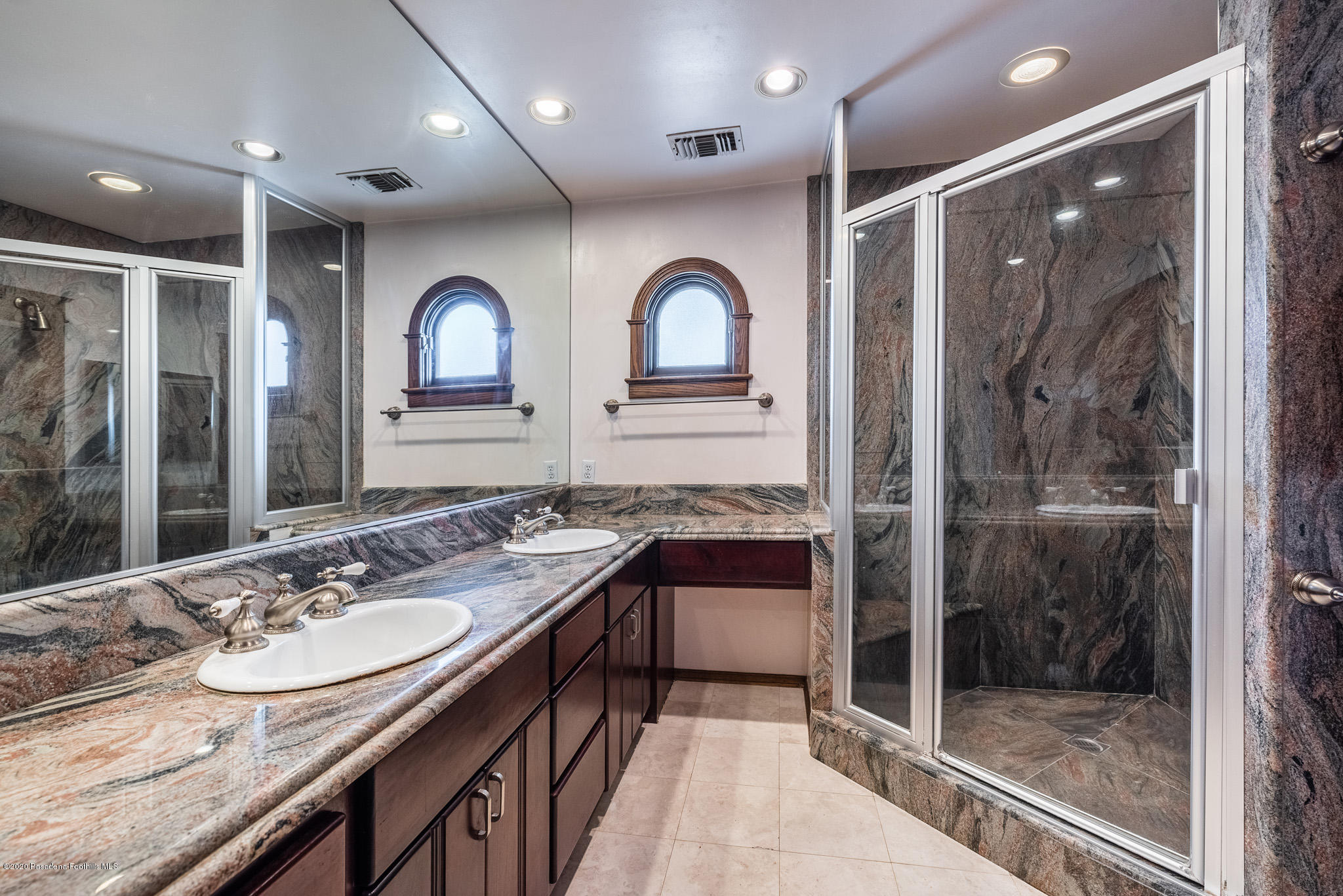 150 Sequoia Drive Pasadena, CA 91105 - Photo 35 of 53 a bathroom with a sink and a mirror