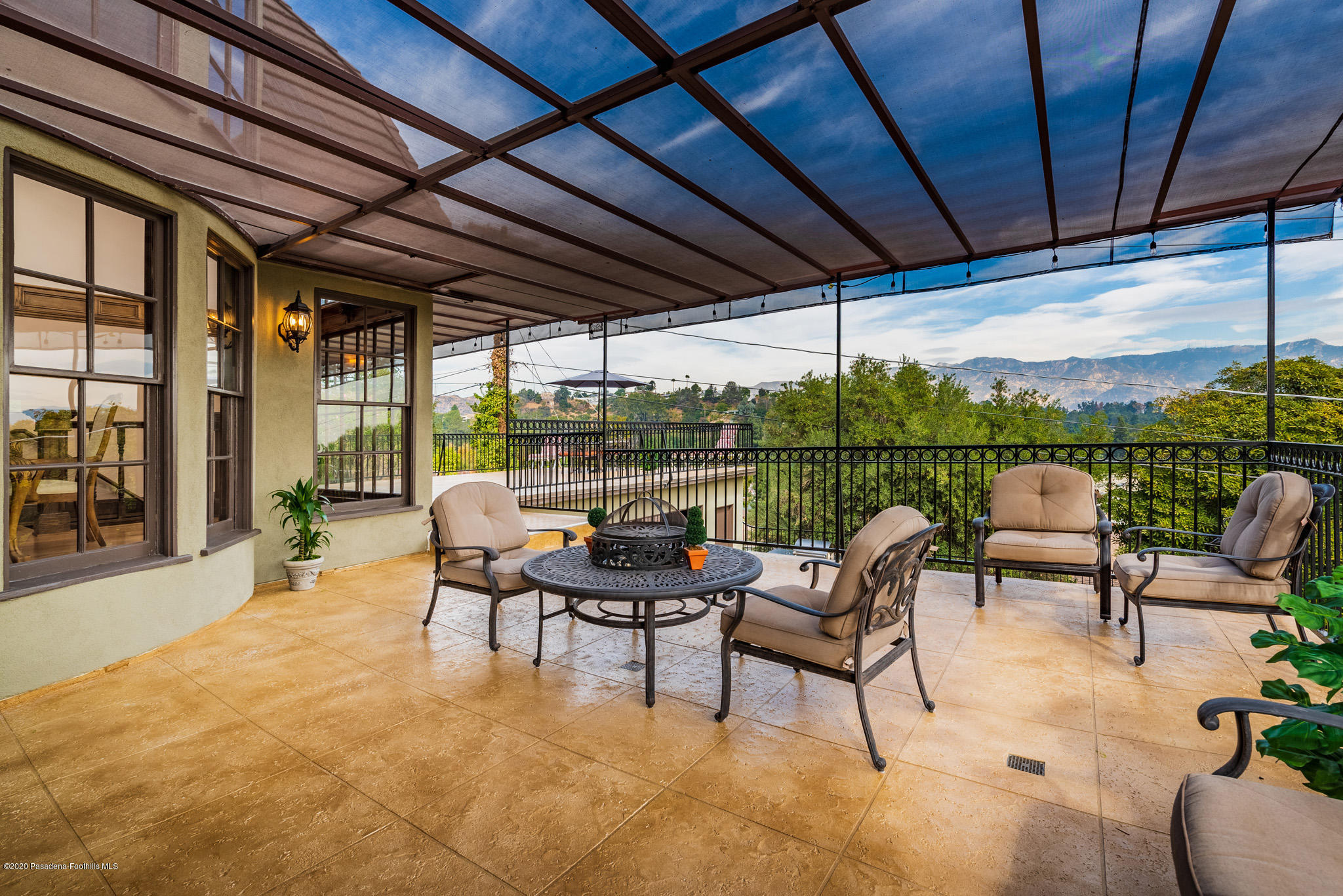 150 Sequoia Drive Pasadena, CA 91105 - Photo 40 of 53 a view of a patio with a table chairs and a backyard