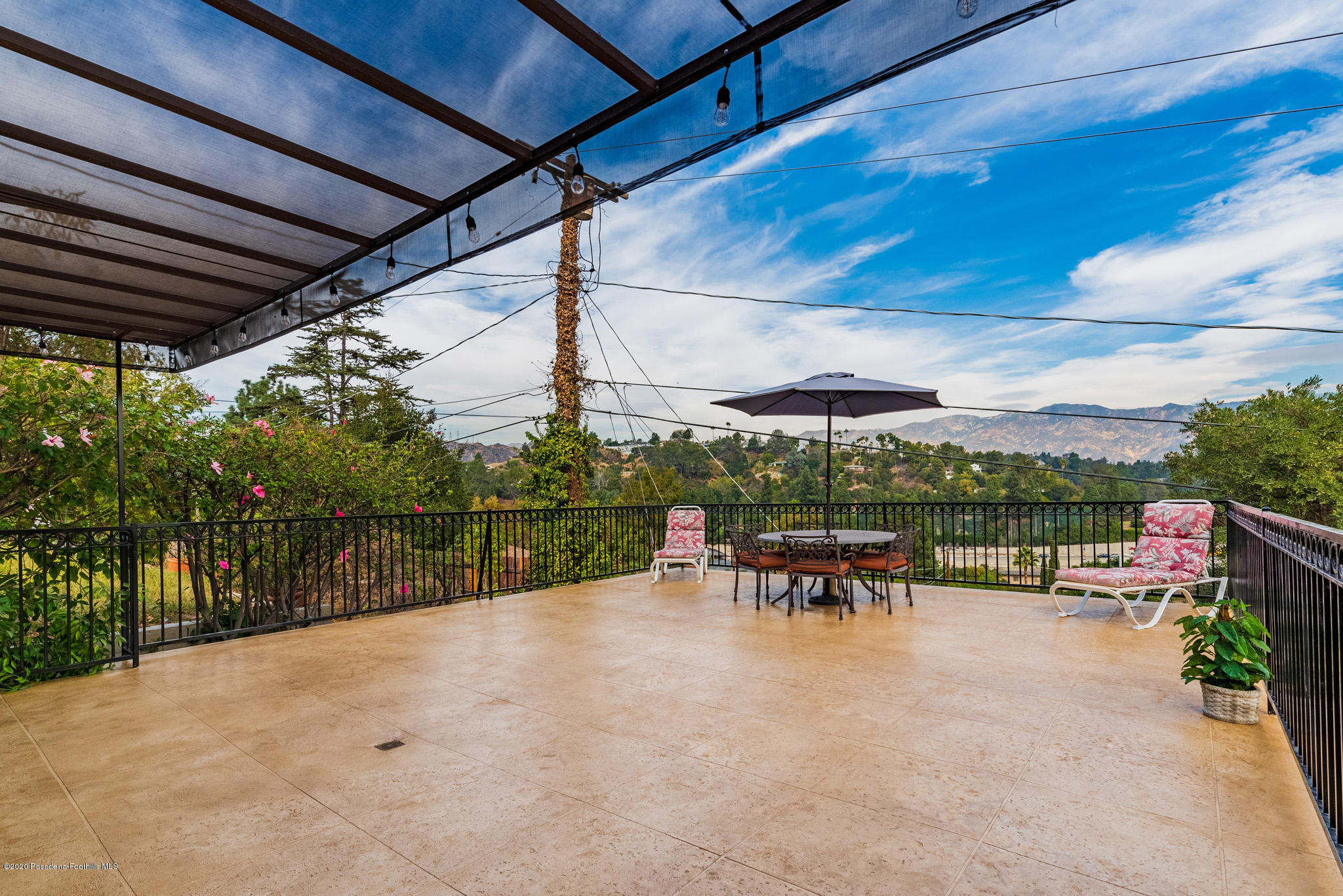 150 Sequoia Drive Pasadena, CA 91105 - Photo 41 of 53 a view of a patio with a table and chairs