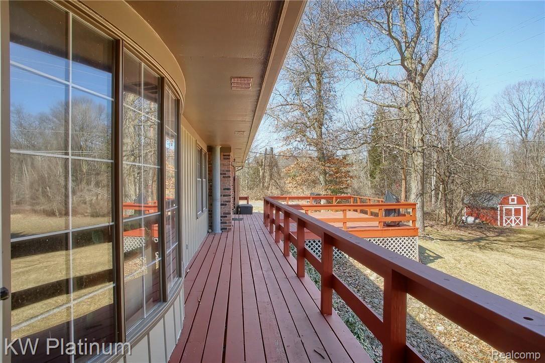 1925 Brewer Road Leonard, MI 48367 - Photo 24 of 47 24-Master Bedroom Deck.jpg