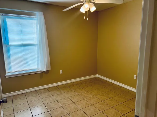 a view of a backyard with a wooden fence
