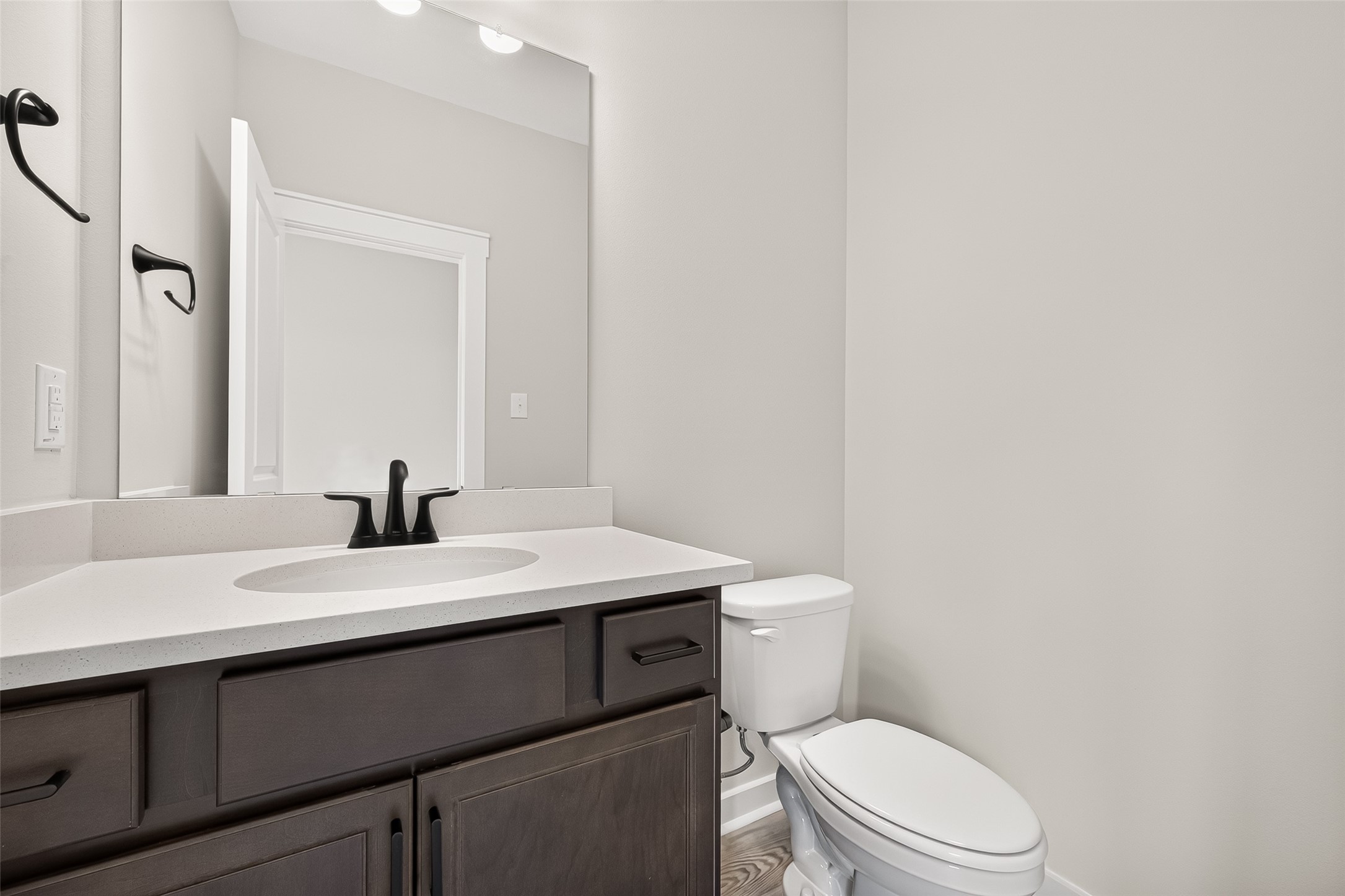 21122 Autumn Heights Rosharon, TX 77583 - Photo 21 of 42 a bathroom with a granite countertop toilet sink mirror and vanity