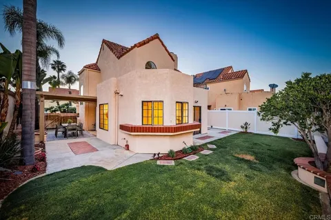 a view of a house with a yard porch and sitting area
