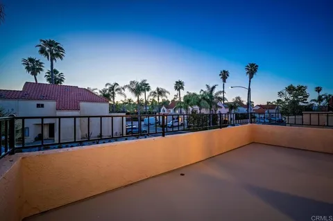 a view of swimming pool with a chairs