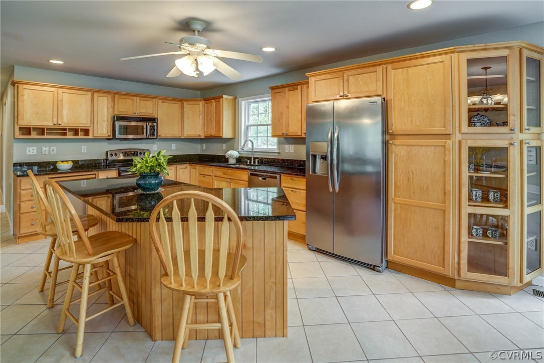 2855 Red Lane Road Powhatan, VA 23139 - Photo 12 of 42 a kitchen with stainless steel appliances granite countertop a refrigerator a stove a sink dishwasher and a dining table with wooden floor