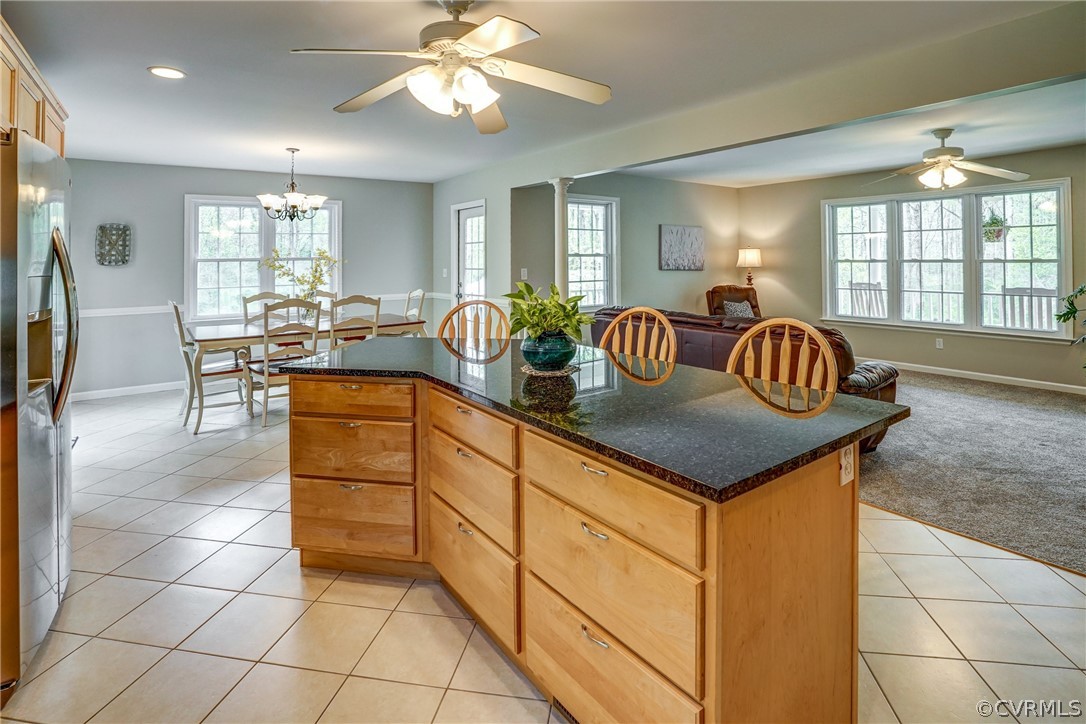 2855 Red Lane Road Powhatan, VA 23139 - Photo 13 of 42 a kitchen with a stove a sink dishwasher a dining table and chairs with wooden floor